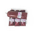 Four 5lb RawFedK9 PMR Trio chubs stacked together, showcasing bulk raw dog food options and protein variety.
