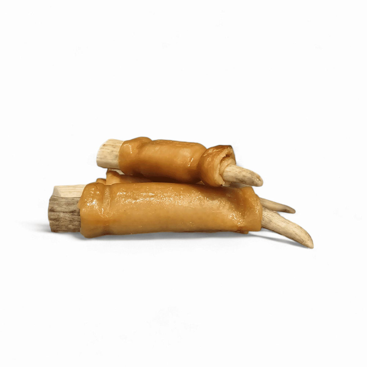 RawFedK9 pork skin–wrapped deer antler chew displayed on a white background